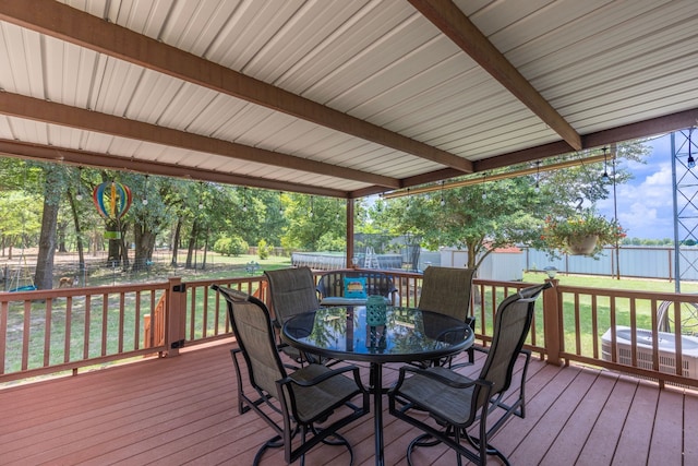 wooden deck featuring central AC unit and a lawn