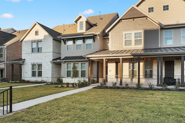 view of front facade with a front lawn and a porch