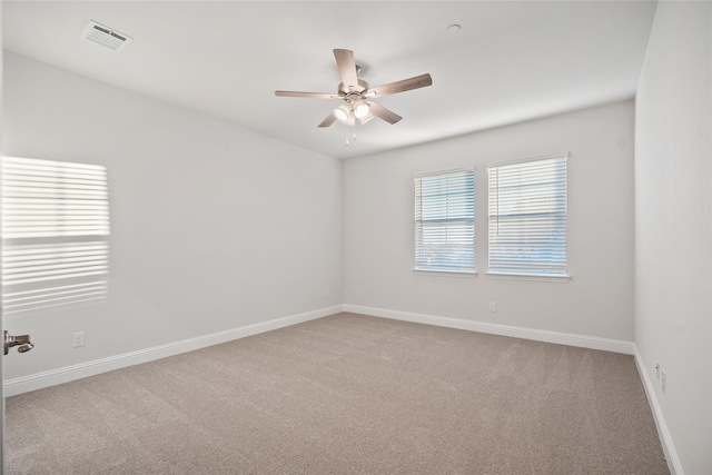 empty room with carpet and ceiling fan