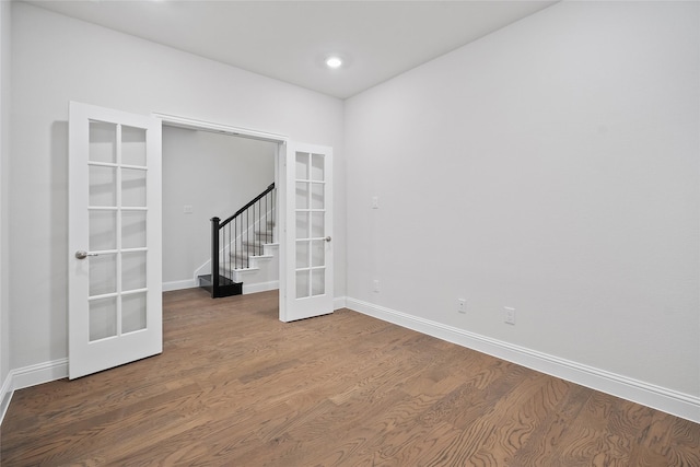 unfurnished room featuring french doors and hardwood / wood-style floors