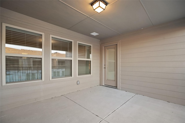 doorway to property featuring a patio area