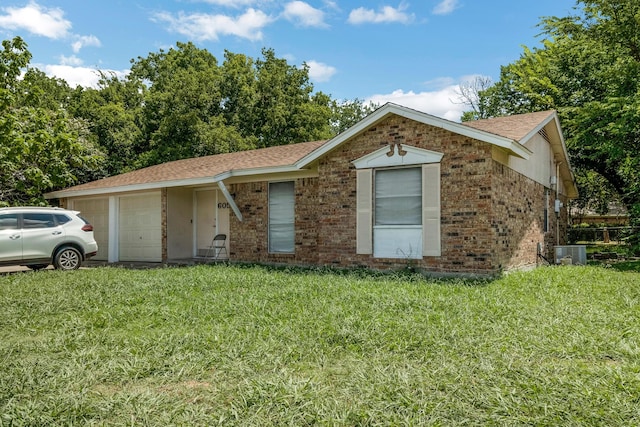 ranch-style house with central AC and a front yard