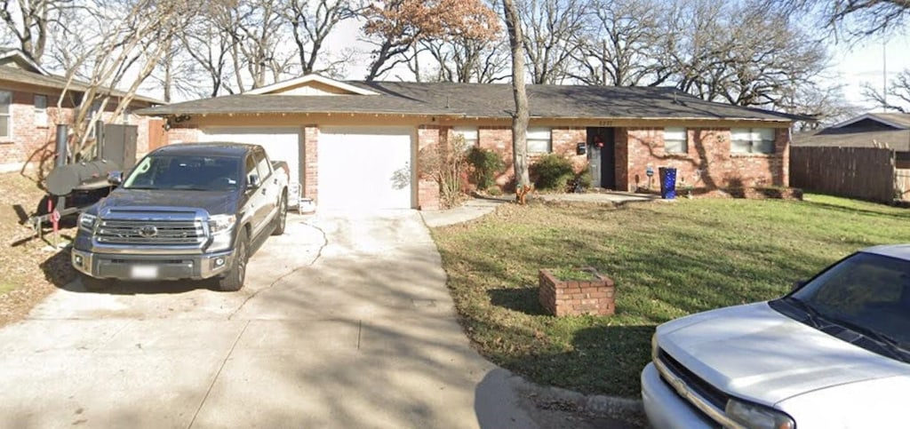 6237 Warrington Pl, Fort Worth, TX 76112 - single story home with concrete driveway, an attached garage, and brick siding