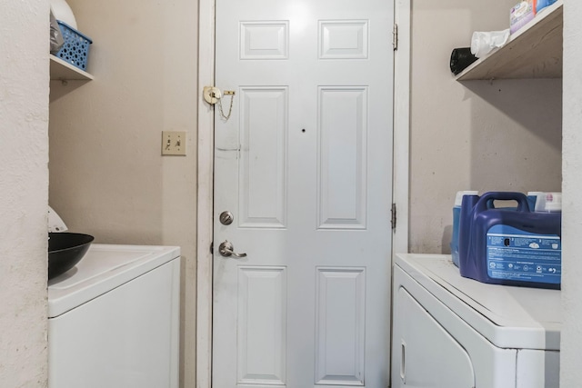 clothes washing area with laundry area and washer and dryer