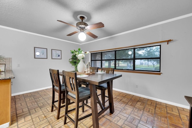 dining room featuring brick floor, crown molding, and baseboards