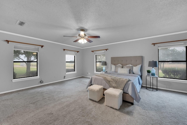 bedroom featuring baseboards, visible vents, carpet flooring, and ornamental molding