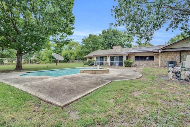 view of swimming pool with a yard, a patio area, fence, and a fenced in pool