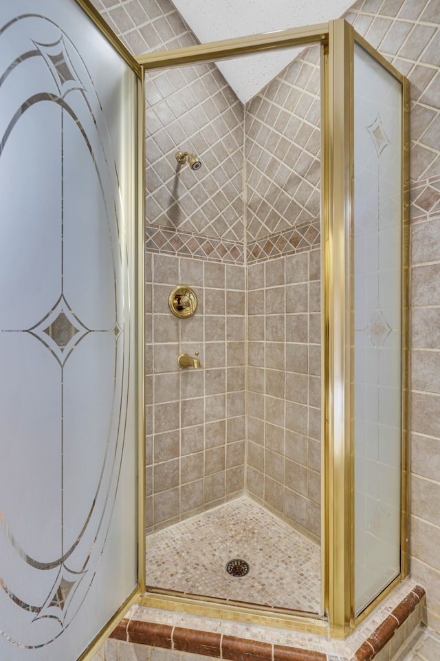 bathroom featuring an enclosed shower