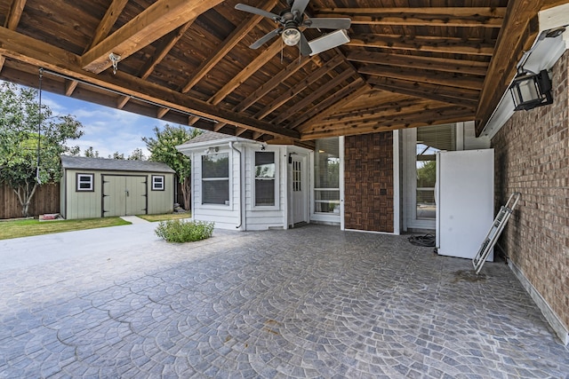 view of patio with a shed and ceiling fan