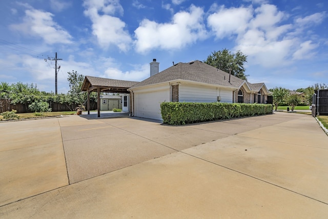 view of side of home with a garage