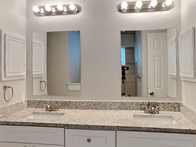 bathroom with dual vanity