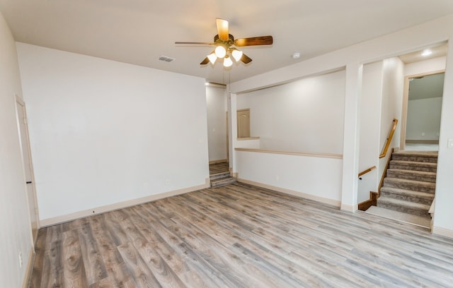 spare room featuring ceiling fan and hardwood / wood-style floors