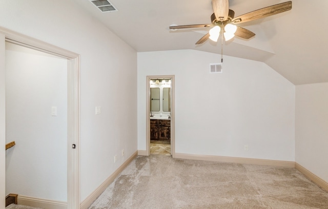 bonus room featuring light carpet, lofted ceiling, and ceiling fan