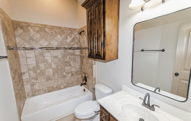 full bathroom featuring vanity, tiled shower / bath combo, and toilet