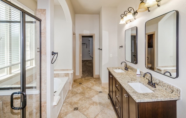 bathroom featuring tile patterned flooring, separate shower and tub, and dual bowl vanity