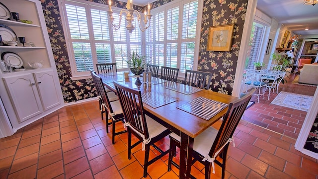 dining area featuring a notable chandelier