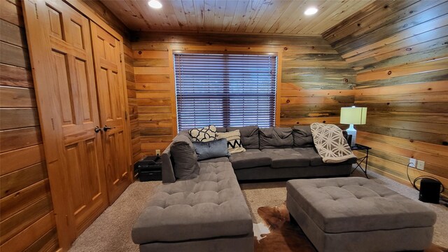 carpeted living room with recessed lighting, wooden ceiling, and wood walls