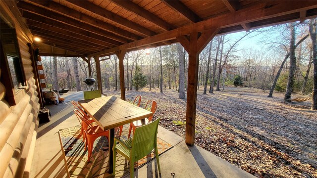 view of patio featuring outdoor dining area