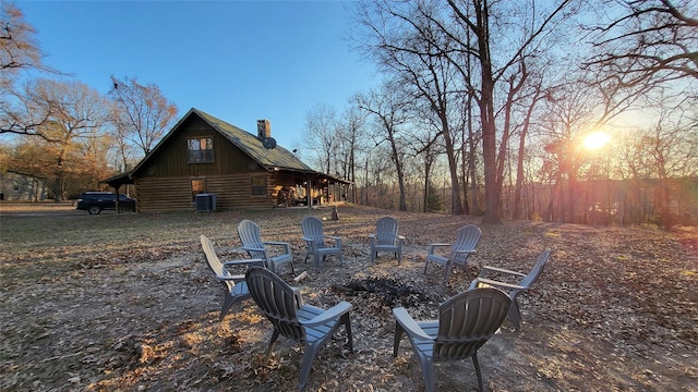 exterior space featuring a fire pit and central AC unit