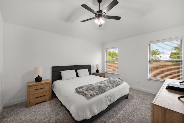 bedroom featuring multiple windows, carpet, and ceiling fan