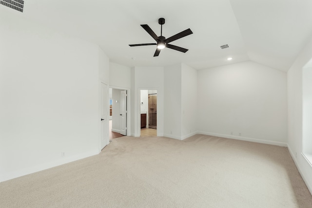 spare room with light carpet, lofted ceiling, and ceiling fan