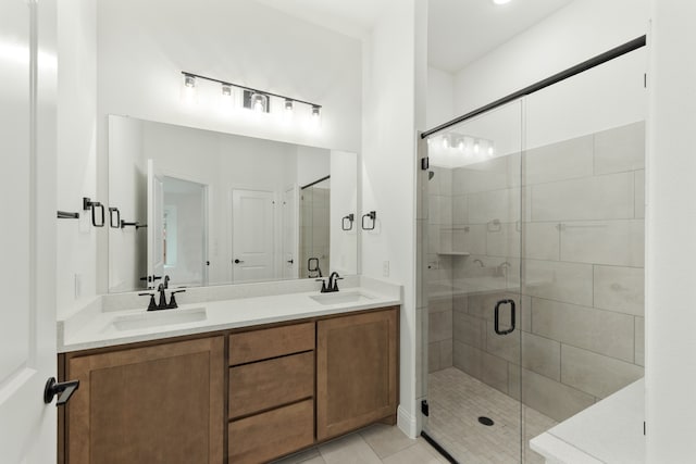 bathroom featuring vanity, tile patterned flooring, and an enclosed shower