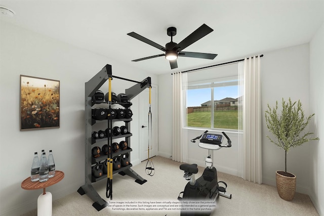 workout area featuring ceiling fan and carpet flooring