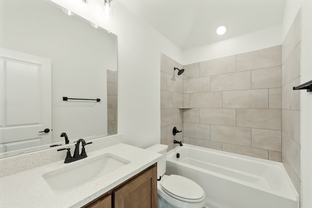 full bathroom featuring vanity, toilet, and tiled shower / bath