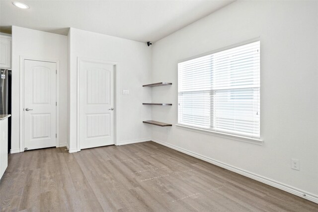 empty room featuring light hardwood / wood-style floors