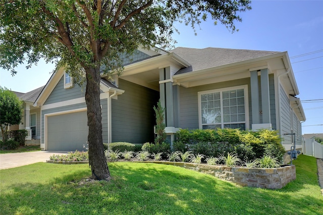 single story home featuring a garage and a front lawn