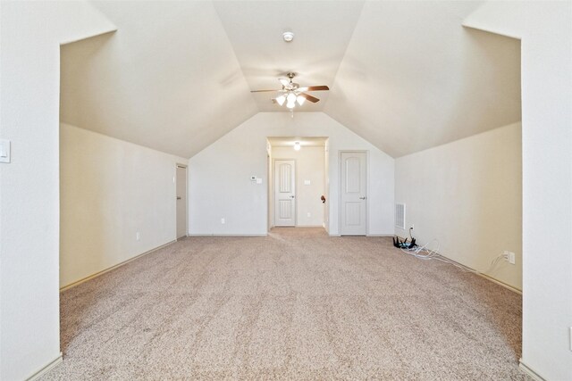 bonus room featuring light carpet, vaulted ceiling, and ceiling fan