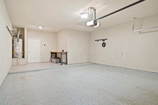 garage with a garage door opener and gas water heater