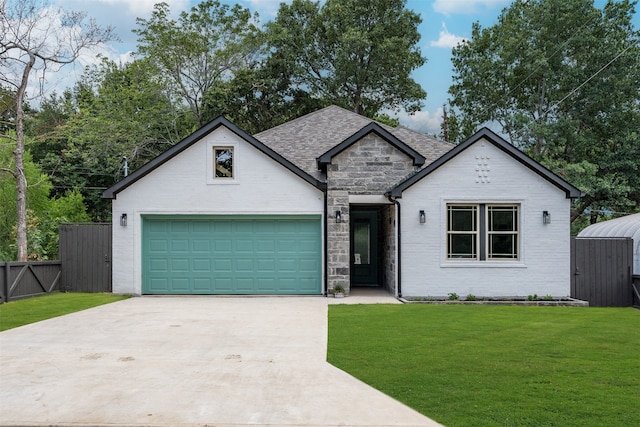 view of front of house featuring a front lawn and a garage