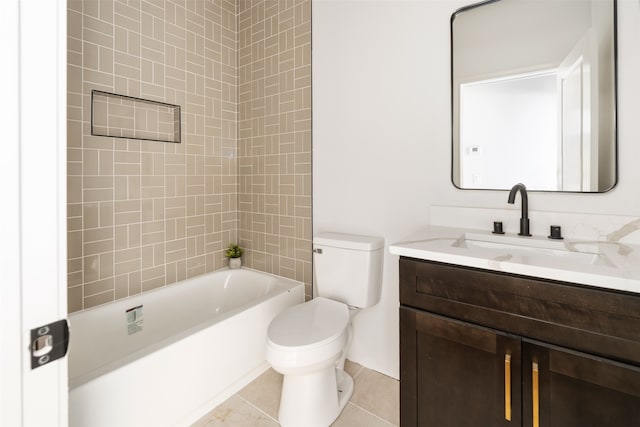 full bathroom with tiled shower / bath combo, toilet, tile patterned floors, and vanity