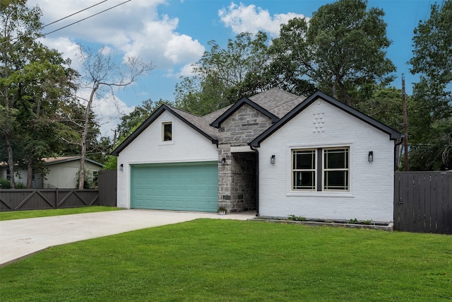 view of front of home featuring a front yard and a garage