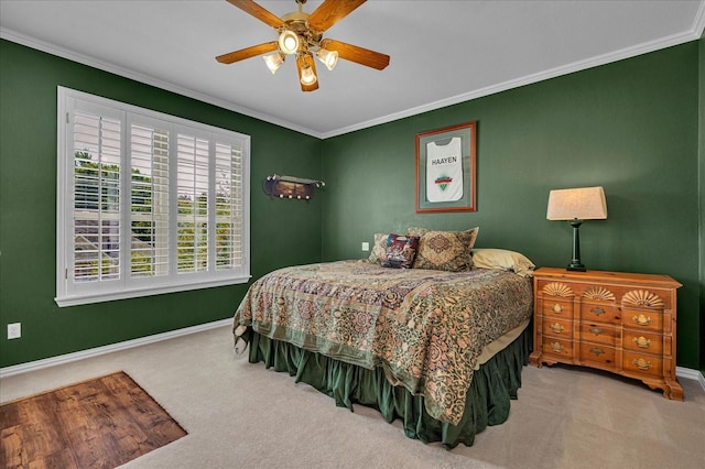 bedroom with light carpet, ornamental molding, and ceiling fan