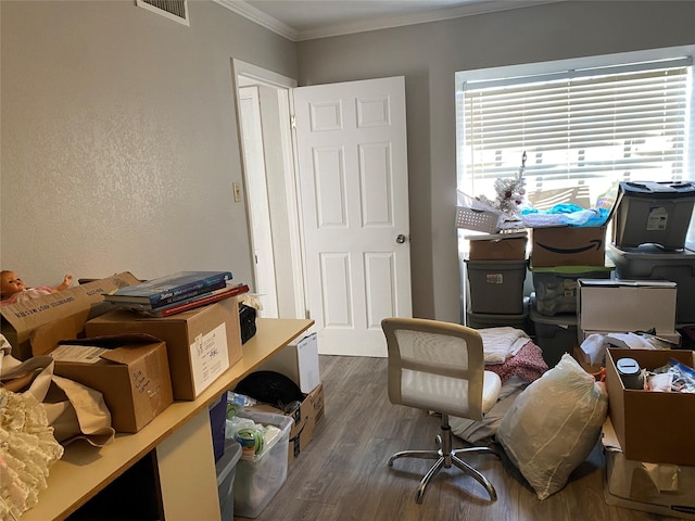 office with crown molding and dark wood-type flooring