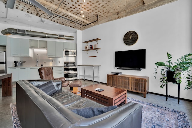 living room with concrete flooring