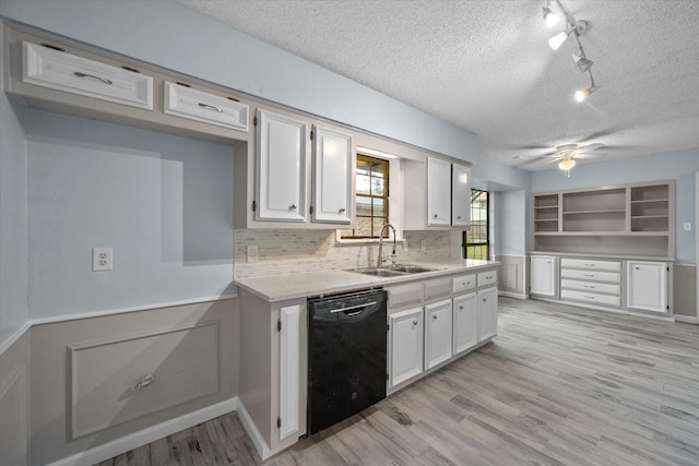 kitchen featuring dishwasher, a textured ceiling, sink, and ceiling fan