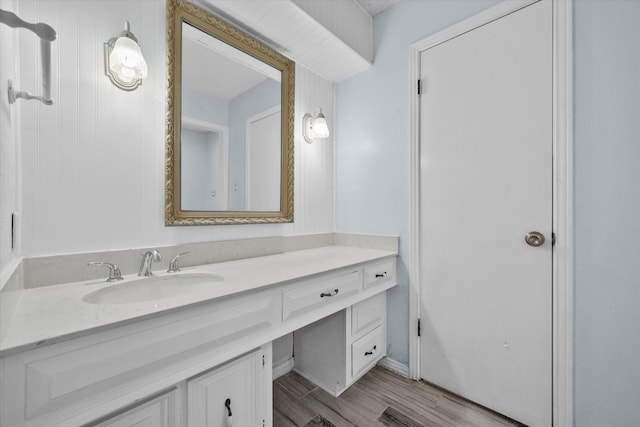 bathroom with vanity and hardwood / wood-style floors