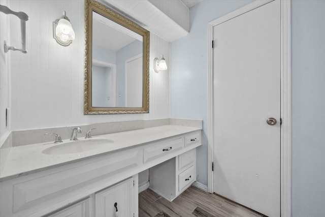 bathroom featuring vanity and wood-type flooring