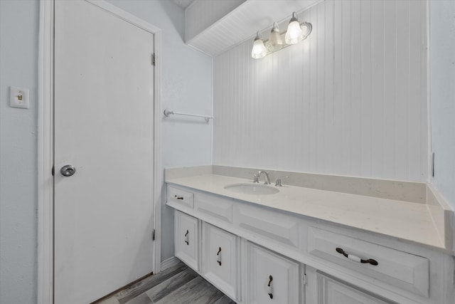 bathroom with vanity and hardwood / wood-style flooring