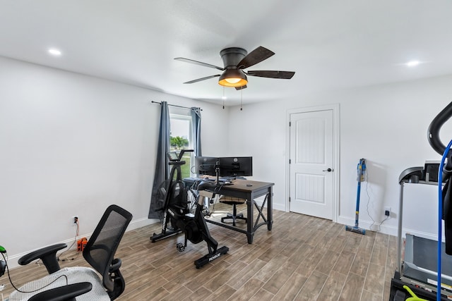 office space with hardwood / wood-style floors and ceiling fan