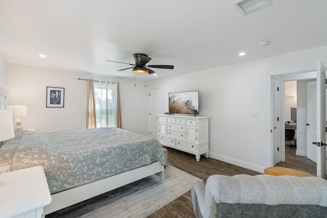 bedroom featuring dark hardwood / wood-style flooring and ceiling fan