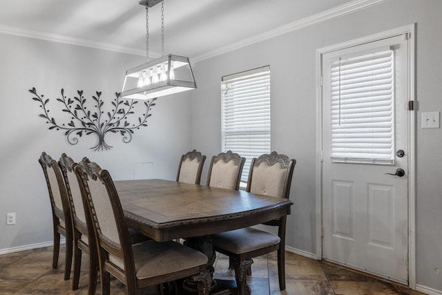 dining space with ornamental molding