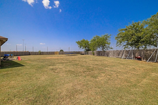 view of yard with a trampoline