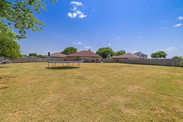 view of yard with a trampoline