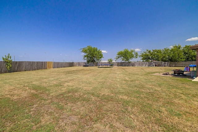 view of yard featuring a fire pit