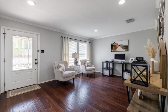 foyer entrance with crown molding and dark hardwood / wood-style flooring