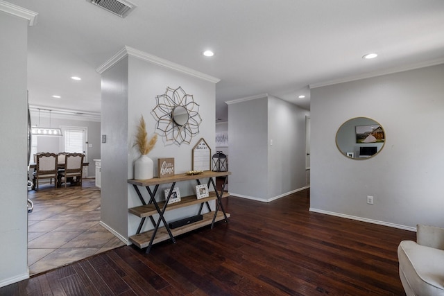 dining area featuring crown molding and dark hardwood / wood-style floors